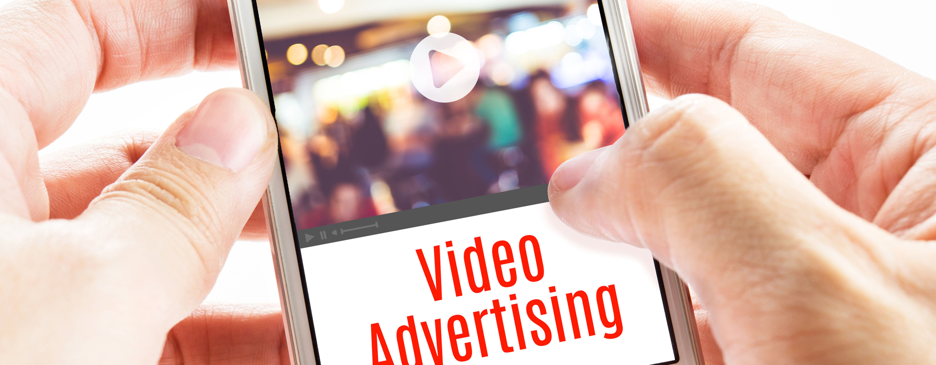 hands holding a mobile phone showing video advertisement
